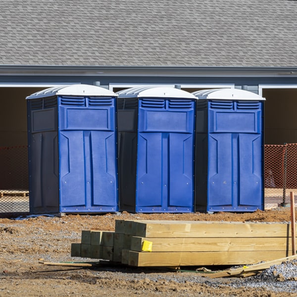 what is the cost difference between standard and deluxe portable restroom rentals in Scotsdale